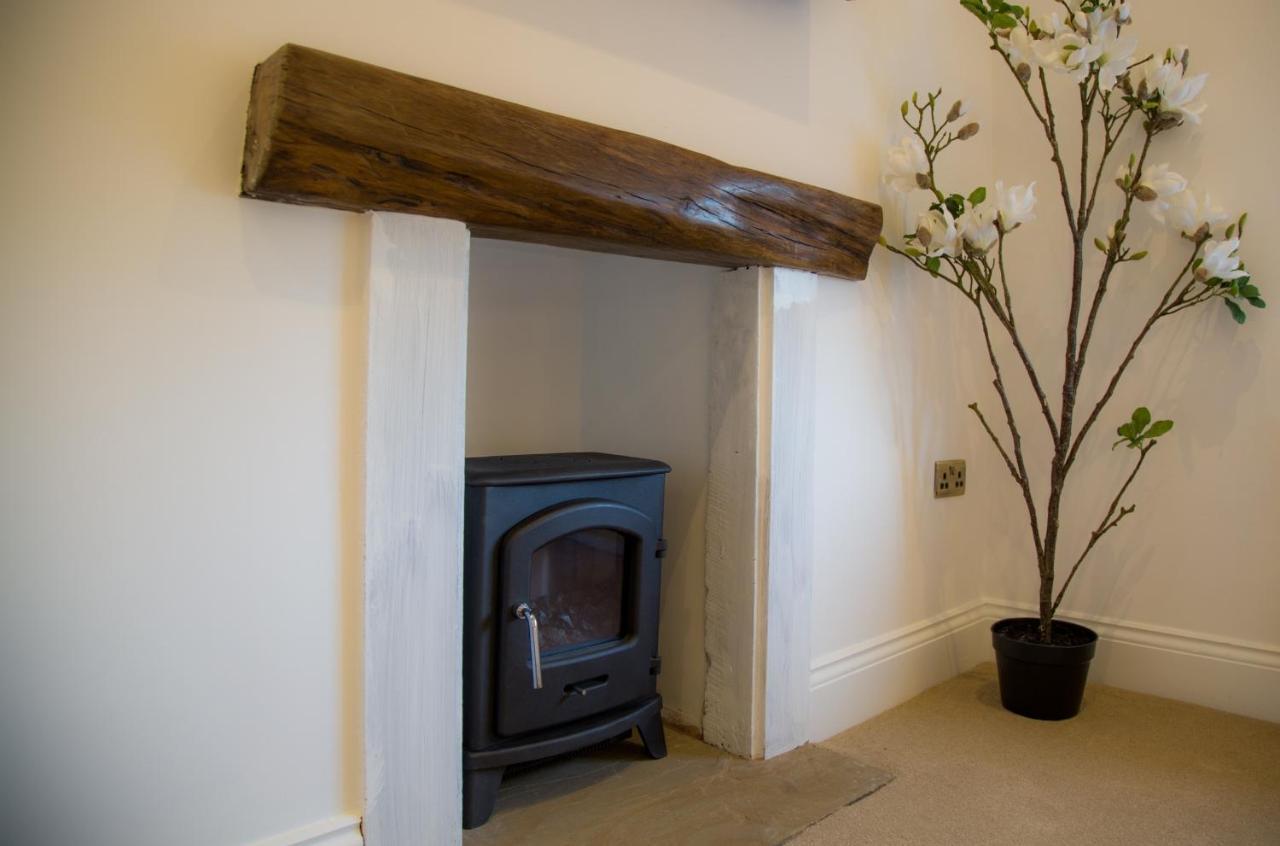 Winckley Stays Preston Kültér fotó A fireplace with a log burning stove